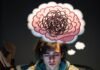 Mind-Blowing Science Trivia Questions to Test Your IQ Shocked young man with ramen noodles on hoodie, exploding brain thought bubble