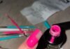 The Ultimate Nail Art Kit for Beginners: Everything You Need to Start Chaotic half-painted neon pink nail with spilled polish and rhinestone mishap