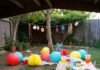 Summer Party Decor DIY: How to Throw the Ultimate Outdoor Gathering Wobbly backyard party scene with spilling drinks