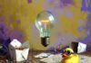 Inventors and Inventions Quiz: Can You Match the Genius to Their Creation? Melted vintage bulb floats over chaotic inventor desk