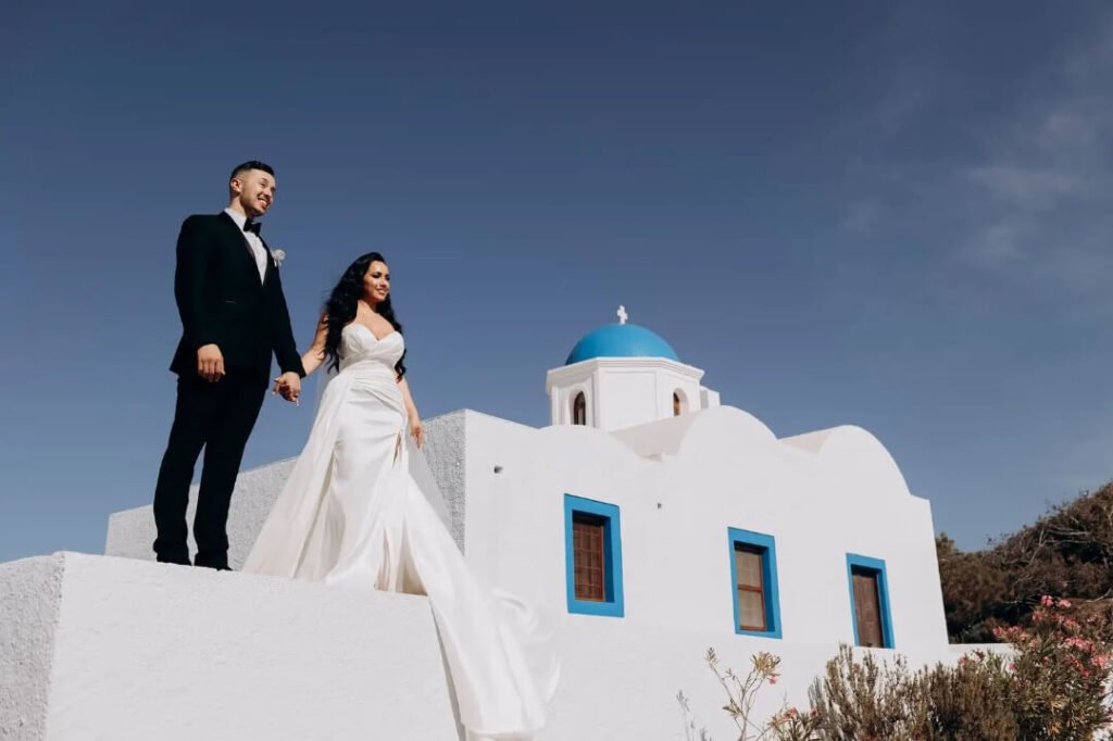 Dreamy Santorini cliffside wedding ceremony with endless Aegean views.