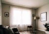 Modern Minimalist Interiors: How to Create a Stylish, Clutter-Free Home "Relaxed view from couch of nearly empty minimalist living room"